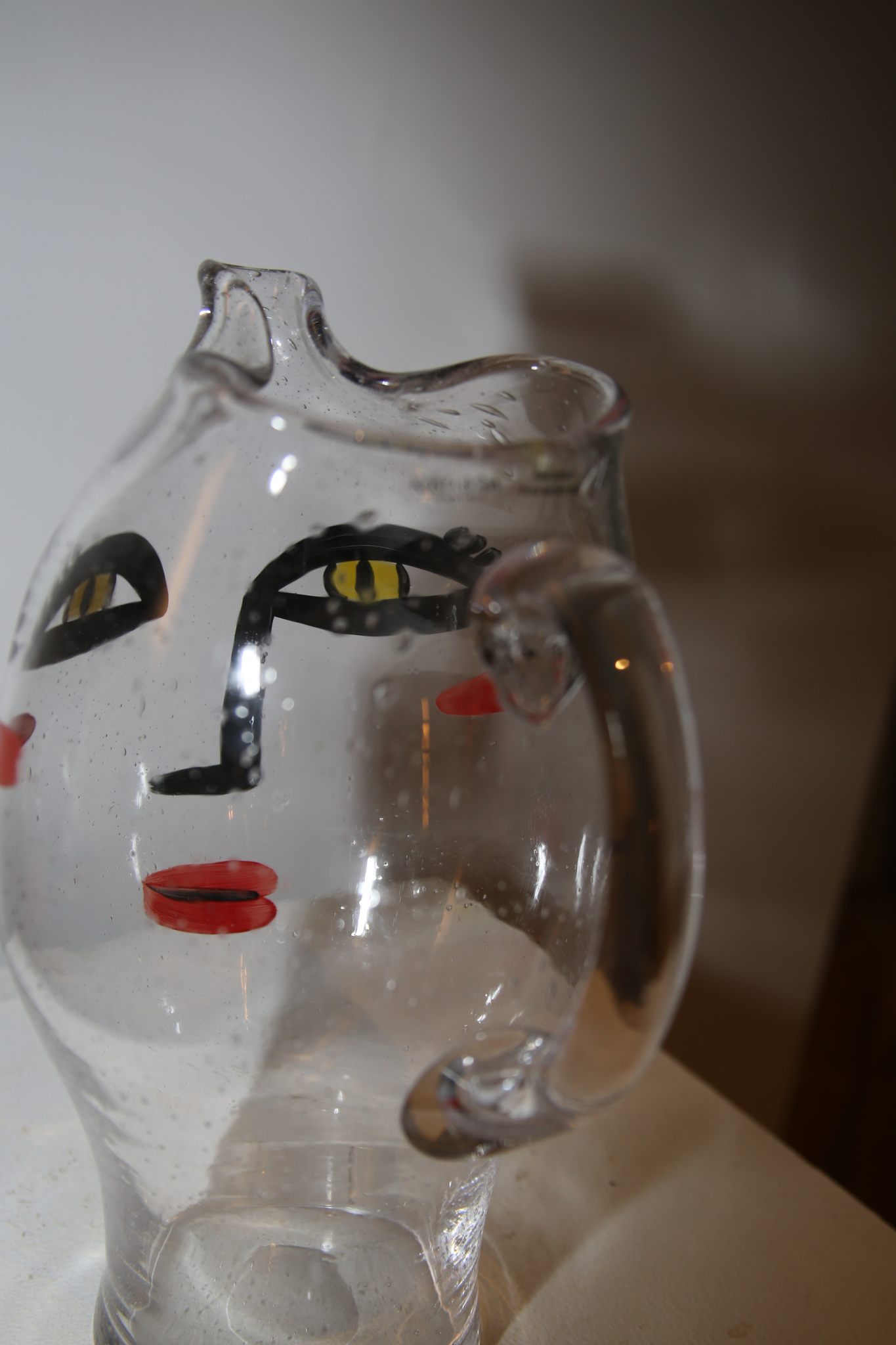 KOSTA BODA / GLASS PITCHER WITH HAND PAINT FACE